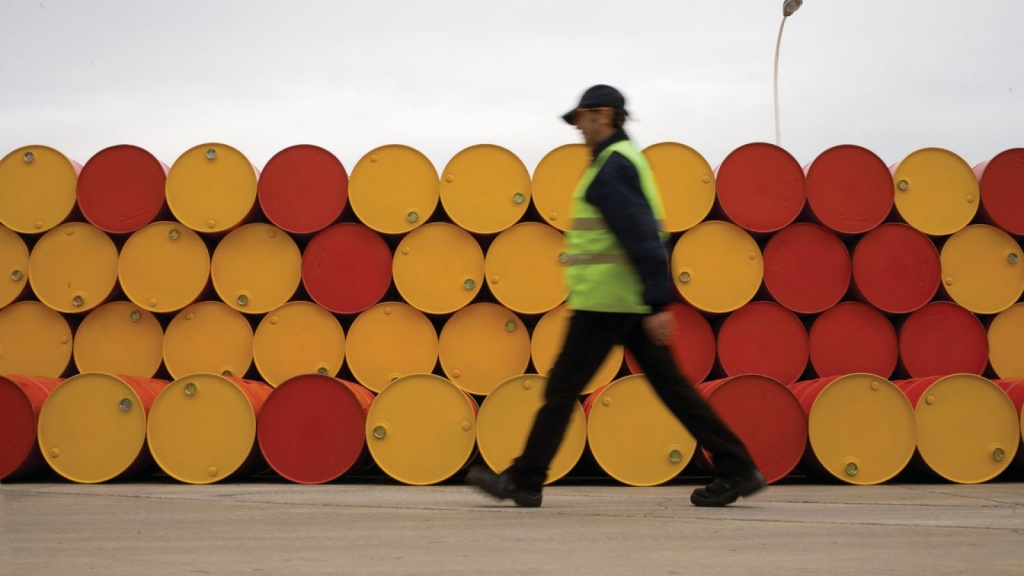 man-walking-barrels-lubricants.jpeg image